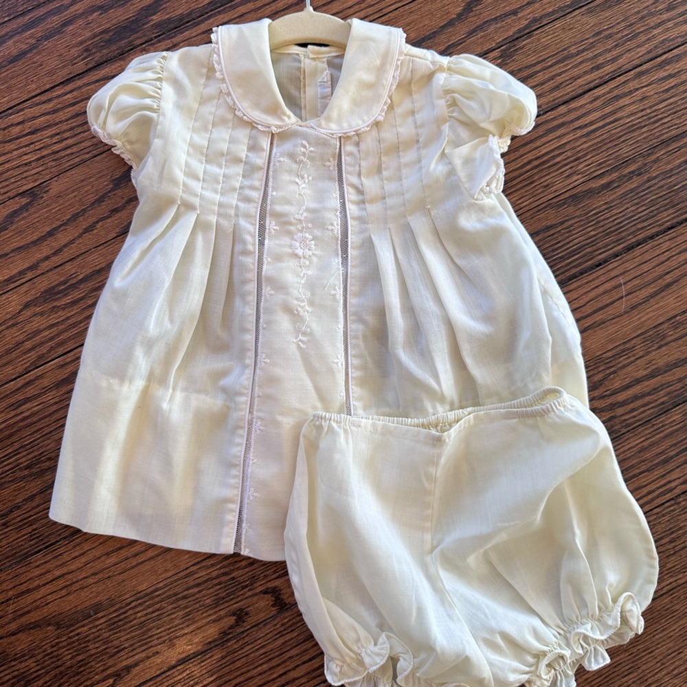 Traditional baby girl, dress in light yellow with tons of gorgeous detail